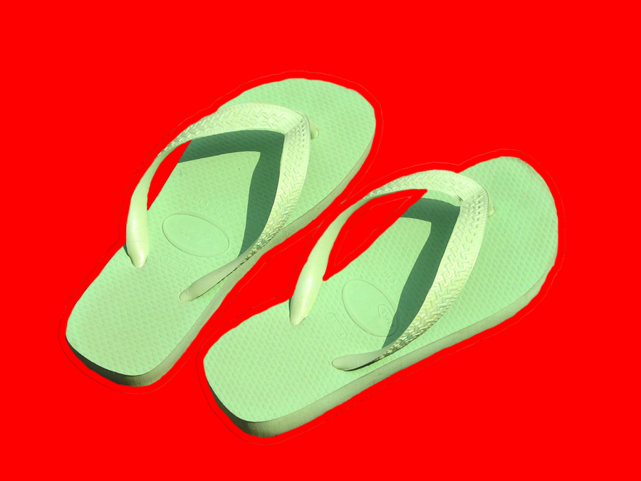 picture of flip flops on a red background